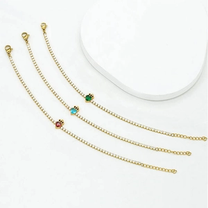 Elegant gold heart bracelets with red, blue and green zircon stones and crown detail