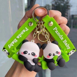 Cute panda baby keychain with green silicone straps and 3D bamboo panda figures