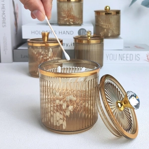 Amber glass storage jar with gold trim and crystal lid for cotton swabs