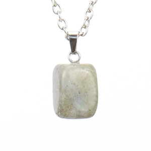 Macro detail of natural tiger eye stone pendant with a silver-colored O-chain necklace
