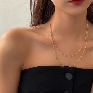 Double-layered gold micro bead necklace for women with minimalist stacked chain design