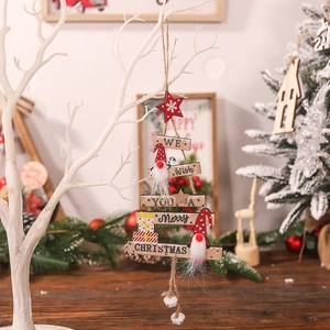 Wooden Christmas tree pendant with Santa Claus figure, stars, and bells hanging on branch
