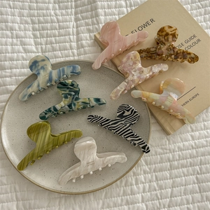 French gradient acetate hair claws with marble and zebra patterns in various colors