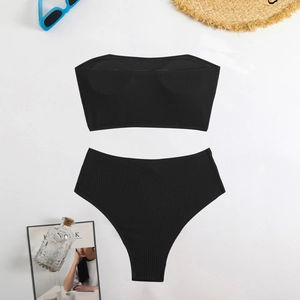 Detailed view of black waffle texture fabric on strapless high-waisted bikini set