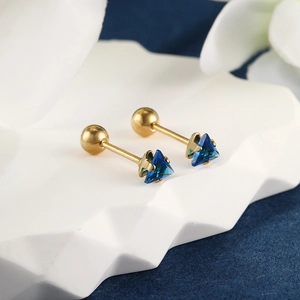 Macro detail of triangle blue gemstone earrings with gold-plated screw ball backs