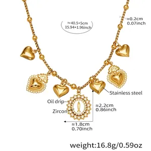 Detail of gold stainless steel necklace showing zircon hearts and religious pendant