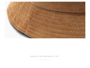 Macro detail of brown corduroy baseball cap showing fine stitching and ribbed fabric texture