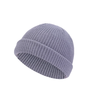 Detailed close-up of grey ribbed knit skull cap with high-elastic cuff and thick texture
