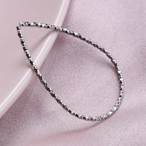 Minimalist silver 304 stainless steel geometric bangle with diamond cut texture for women