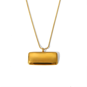 Close-up of golden rectangular mirror pendant on a sleek snake chain necklace