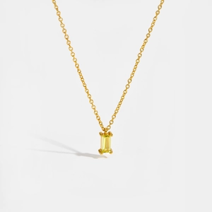 Close-up of a rectangular champagne stone pendant on a delicate gold S925 silver chain