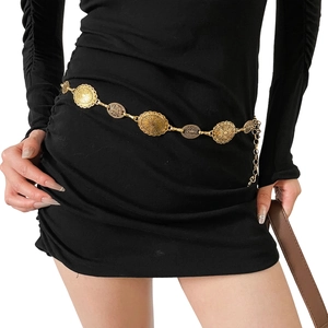 Adjustable vintage gold metal chain belt with embossed oval links on black dress