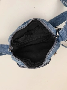 Retro denim mini crossbody bag featuring a black interior compartment and metal zipper
