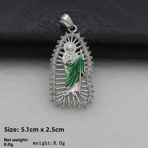 Religious pendant detail showing green enamel figure and clear size specs 5.1cm x 2.5cm