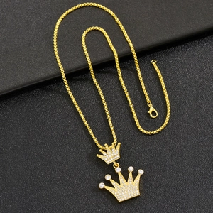 Hip hop gold crown pendant necklace with sparkling crystals for men on black background