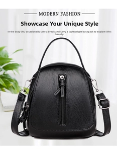 Detailed close-up of a black lychee texture leather crossbody bag with vertical zipper