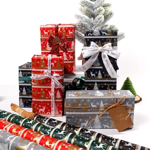 Christmas wrapping paper rolls with reindeer and snowflake patterns for holiday gifts