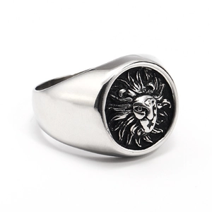 Macro view of detailed lion head engraving on vintage stainless steel men's ring