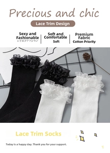 Detail of delicate lace trim on ribbed cotton socks in classic black and white