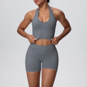 Detail of gray yoga set with ribbed knit texture on halter top and high-waisted shorts