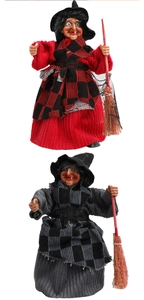Detail of hanging Halloween witch dolls with plaid dresses and brooms for party decor