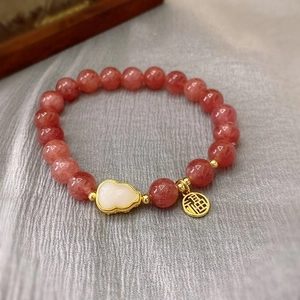 Pink strawberry quartz bracelet with white gourd pendant and golden fortune charm