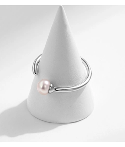 Detailed view of 925 silver ring featuring a pink natural pearl on a display cone