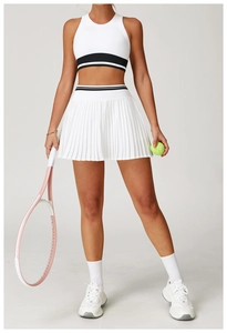 Detail of white sports vest and pleated skirt with striped elastic bands and tennis racket