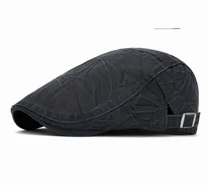 Detail of navy cotton beret featuring vintage washed texture and metal adjustment buckle