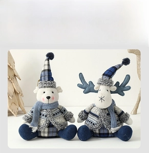 Blue and white plaid plush polar bear and reindeer dolls in a festive winter setting
