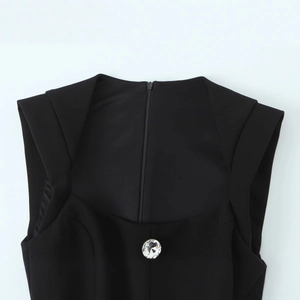 Short black jumpsuit for women with geometric neckline and sparkling rhinestone button
