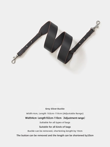 Detail of 4cm wide dark grey leather bag strap with silver buckles and 102-110cm length