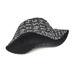 Black bucket hat with white digital graffiti print for sun protection and street style