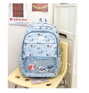 Close-up of light blue dachshund print backpack featuring a transparent display pocket