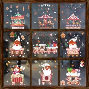 Christmas window decals with Santa gnome, carousel, and snowflakes on a glass window frame