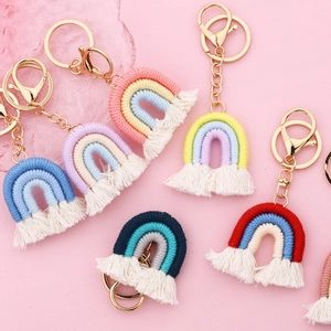 Handmade macrame rainbow keychains in various colors with cotton rope tassels and gold clips
