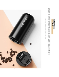 Detail of matte black insulated coffee mug with spill-proof lid and COFFEE text logo