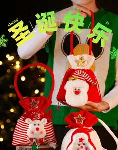 Close-up of knitted Christmas gift bags featuring Santa, Snowman and Reindeer characters