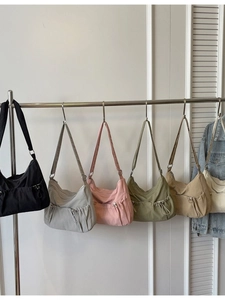 Minimalist nylon pleated crossbody bag with drawstring detail in multiple colors