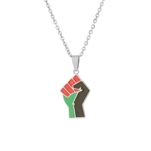 Macro detail of pan-African fist pendant with red black and green enamel finish