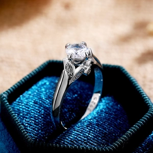 Close-up of S925 sterling silver ring with sparkling round cubic zirconia in a blue box