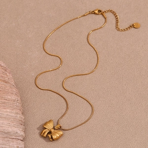 Elegant 18K gold plated stainless steel bow pendant necklace with a fine snake chain