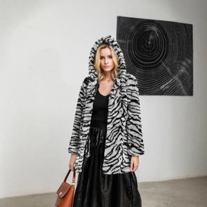 Women's faux fur hooded coat with black and white zebra pattern in a mid-length style