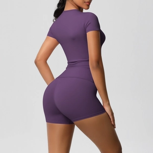 Rear view of purple seamless yoga set showing slimming fit and high-waist lifting shorts