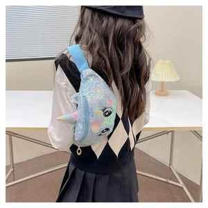 Detail of sequin unicorn chest bag showing 3D horn and embroidery worn by a child