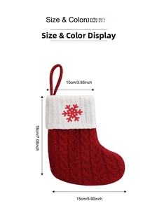 Detail view of red knit Christmas stocking with white snowflake embroidery and size dimensions