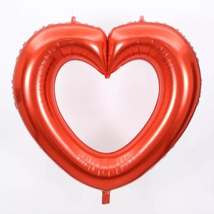 Detail of 40-inch large red hollow heart foil balloon for romantic party decorations