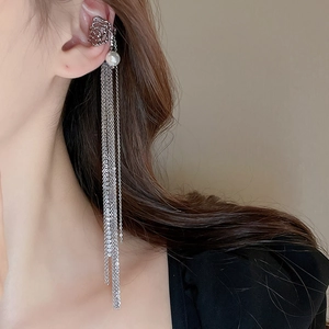Detail of silver tassel ear cuff with rhinestones and pearl on model's ear