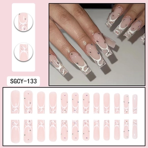 French tip long coffin press-on nails with silver glitter and rhinestone accents
