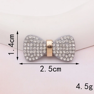 Detail shot of a rhinestone bow accessory measuring 2.5cm by 1.4cm for DIY crafts